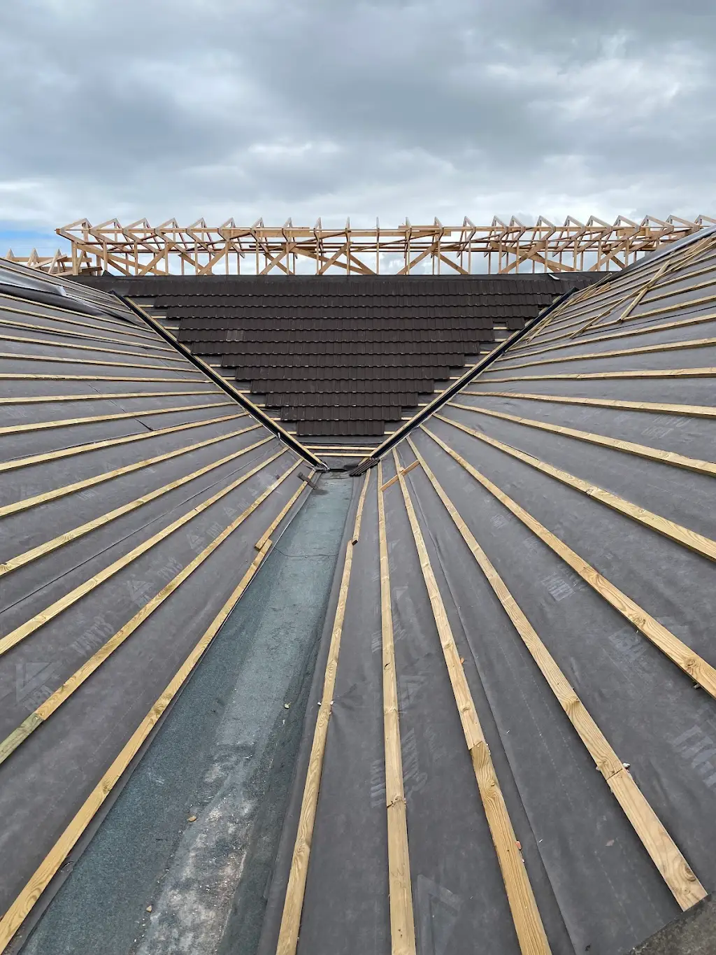 Roof being re-covered with battens and a timber truss frame above