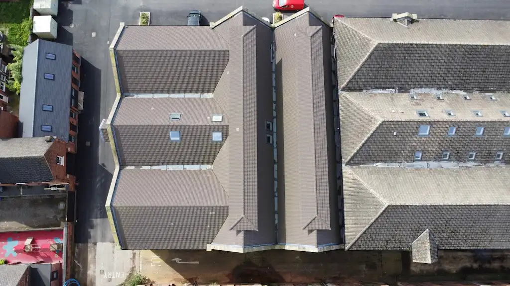Aerial view of new roof slopes on a large commercial building